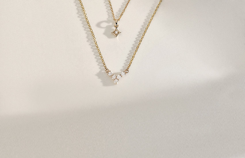 Layered yellow gold diamond necklaces