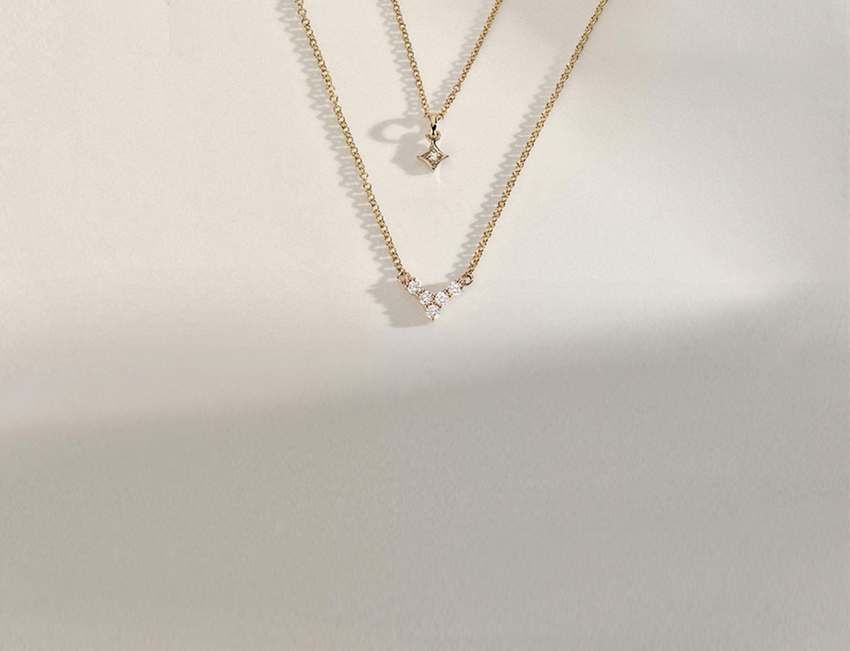 Layered yellow gold diamond necklaces